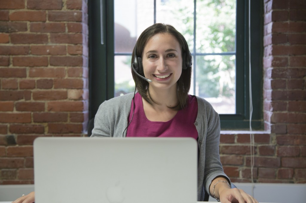 Virtual Assistant, at computer with headset